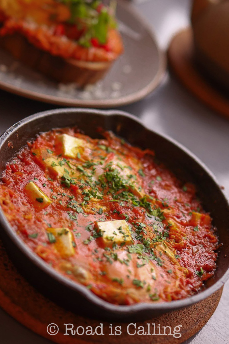 shakshuka served in a hot pan at a brunch spot in Tallinn