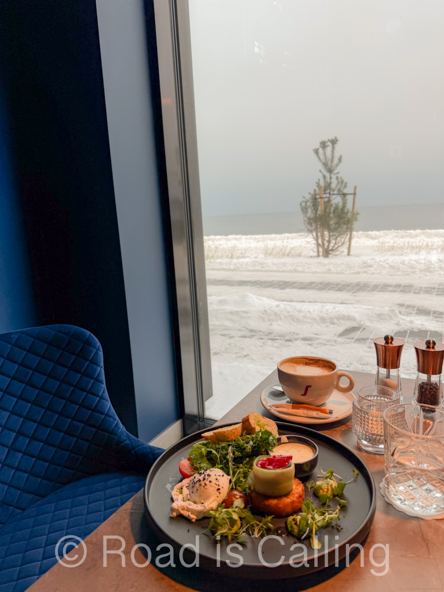 brunch dishes served by a window at a cafe in Tallinn