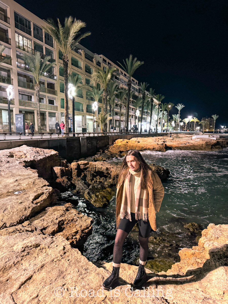 me standing by the sea on the promenadae in Torrevieja in winter at night