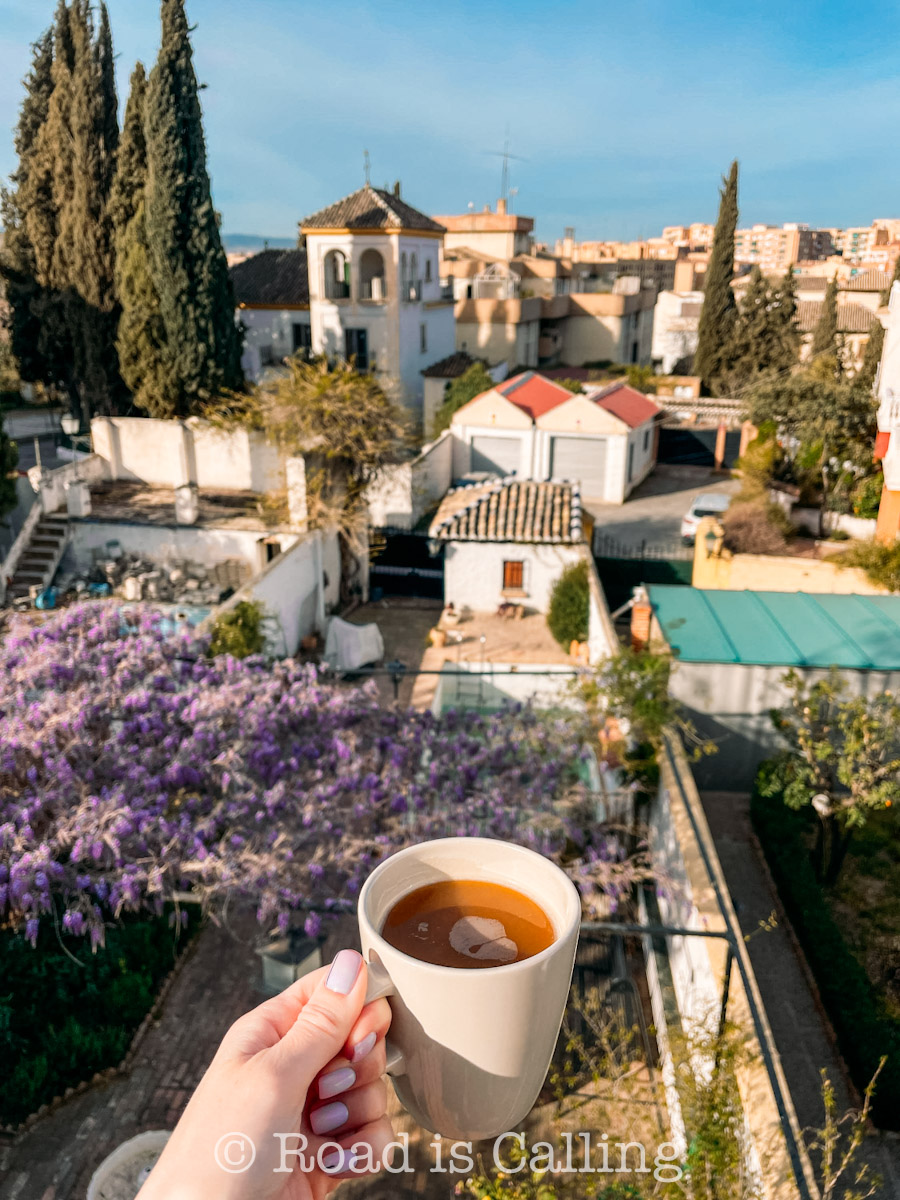 cup of coffee over the residential neighborhood in Granada in winter