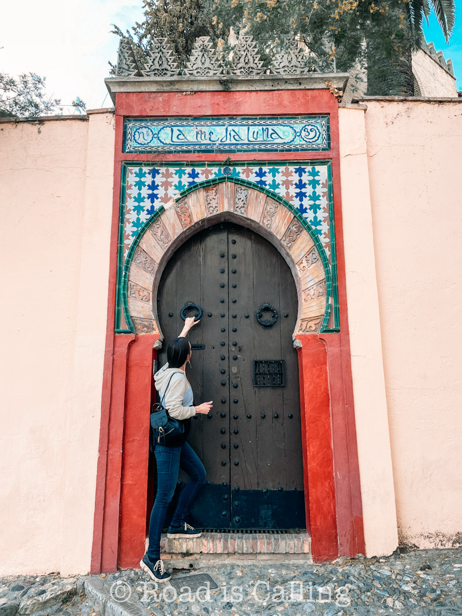 Moorish-style doorway in Granada with colorful tiles and traditional architecture