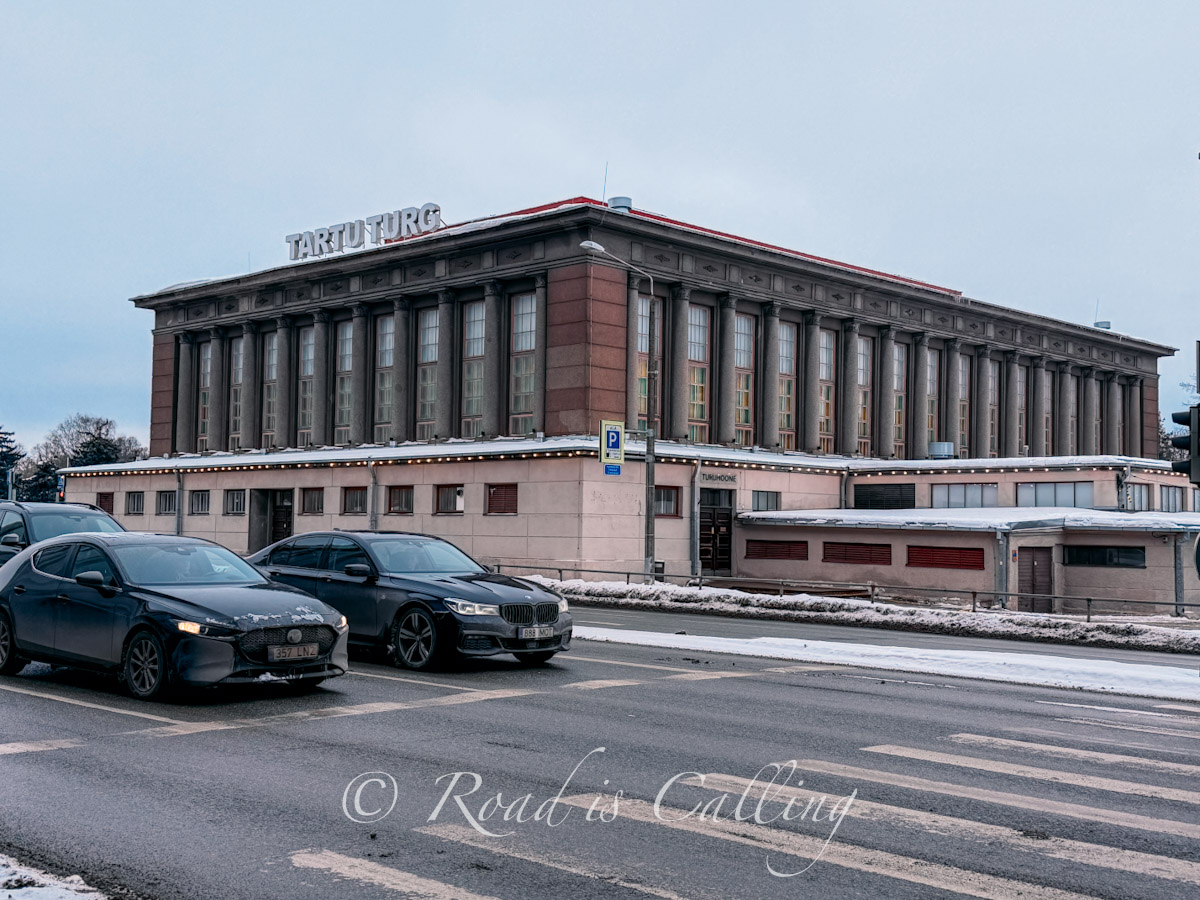 view of the main markethall building in Tartu by the road