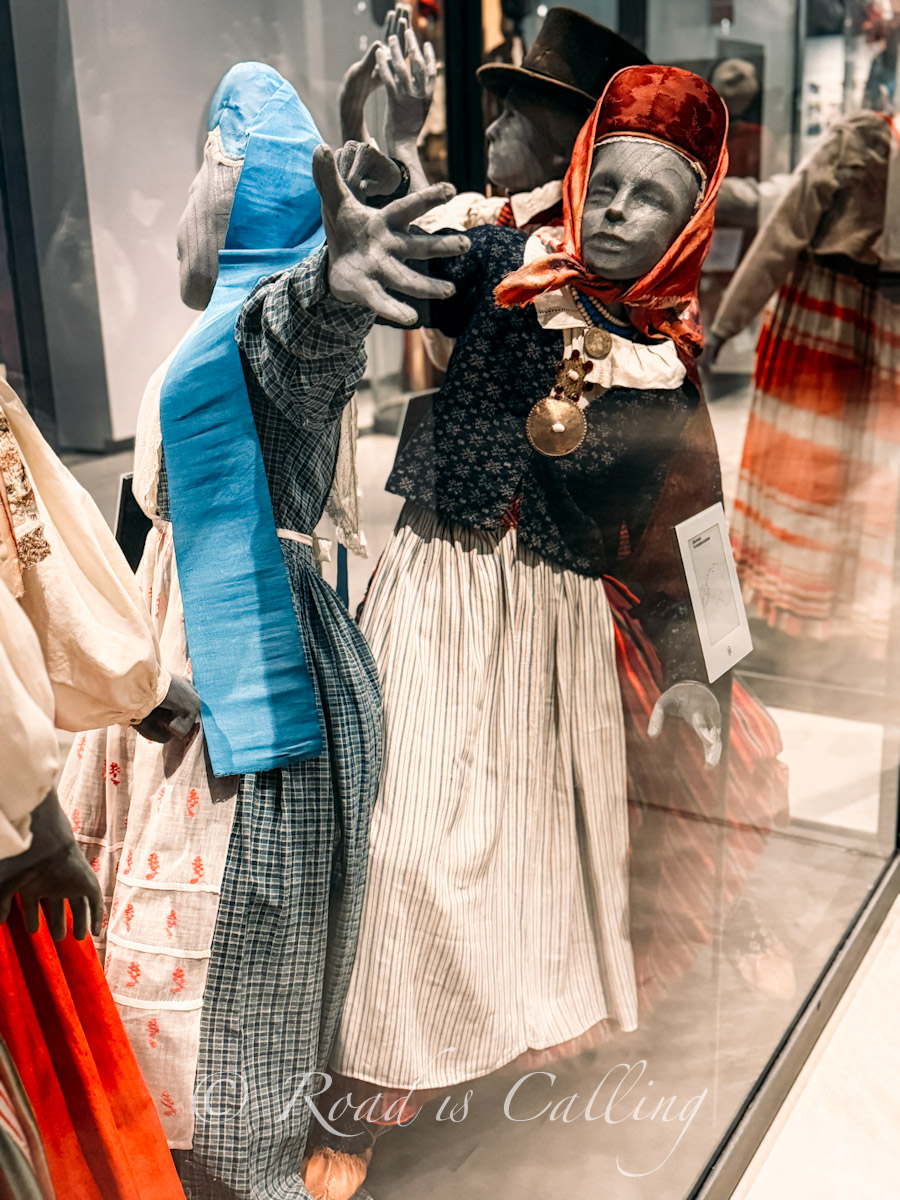 traditional Estonian folk costumes on display in Tartu museum