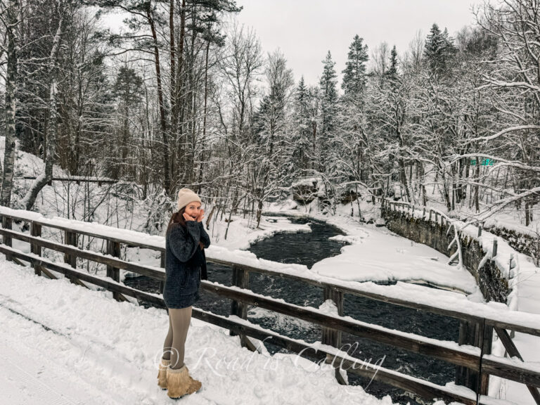 me standing on a snowy wooden boardwalk in Lahemaa National Park in winter