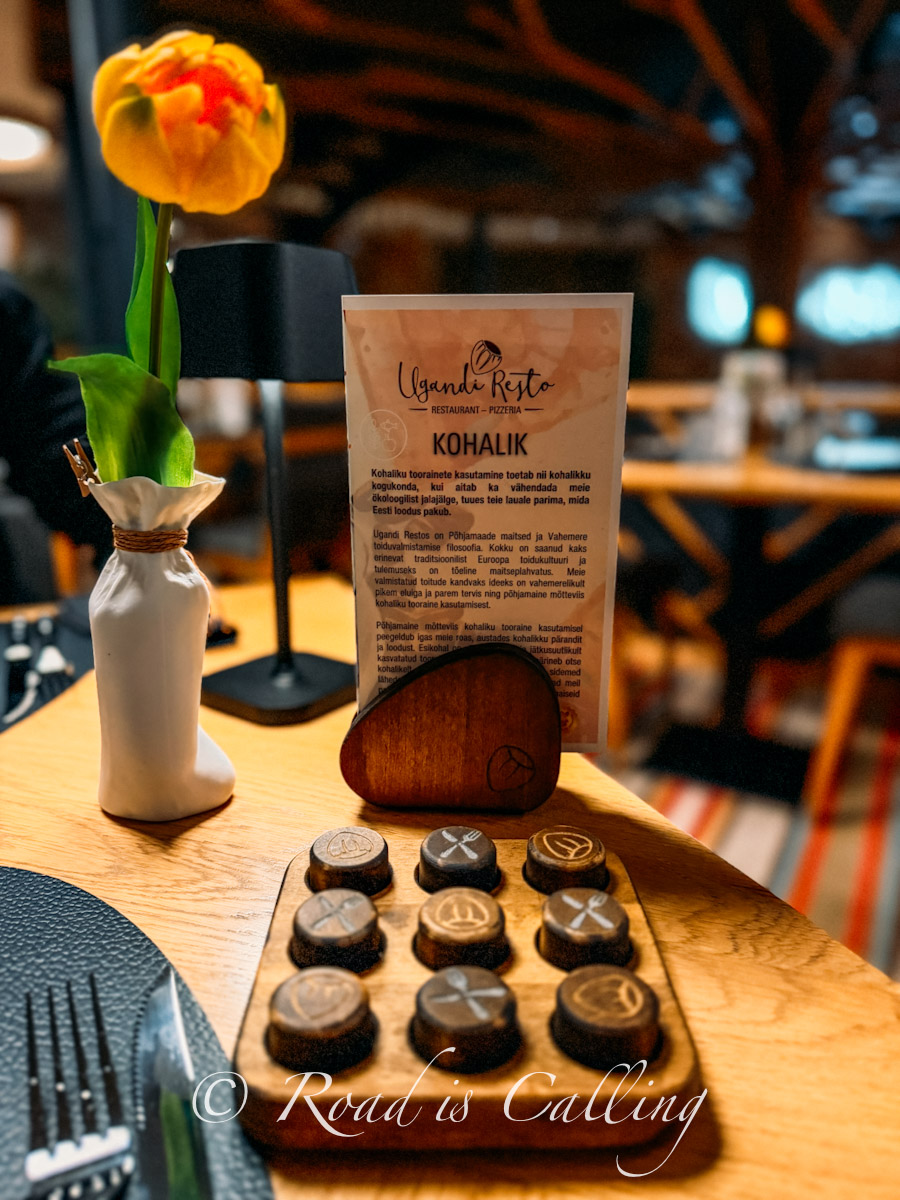 table setting with menu and decorative details in Ugandi Resto restaurant