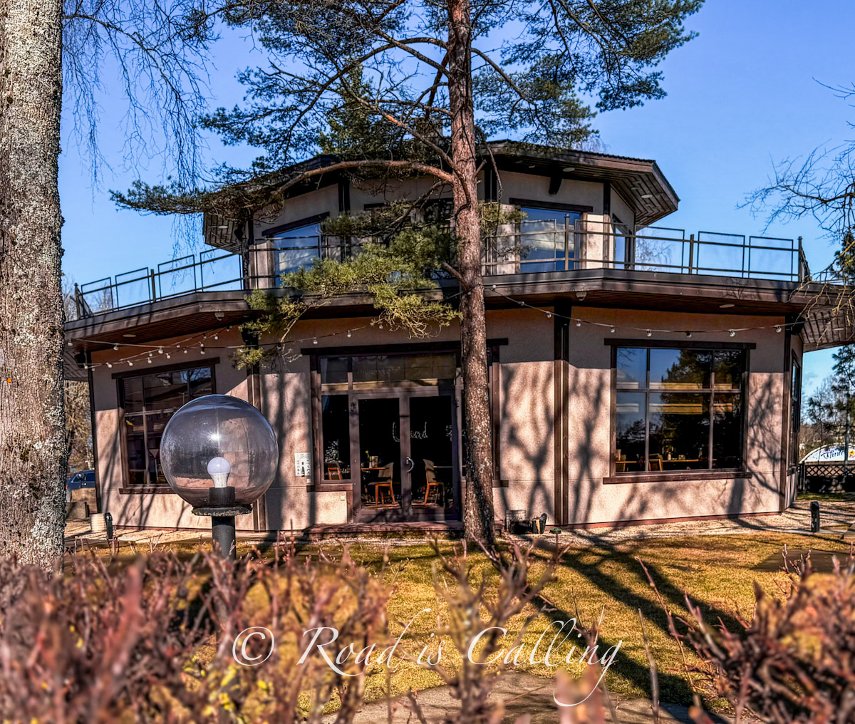Exterior of Ugandi Resto in Otepaa surrounded by pine trees