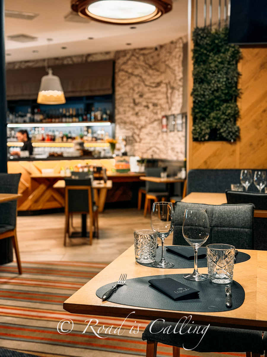 interior of Ugandi Resto with table setting and warm modern design