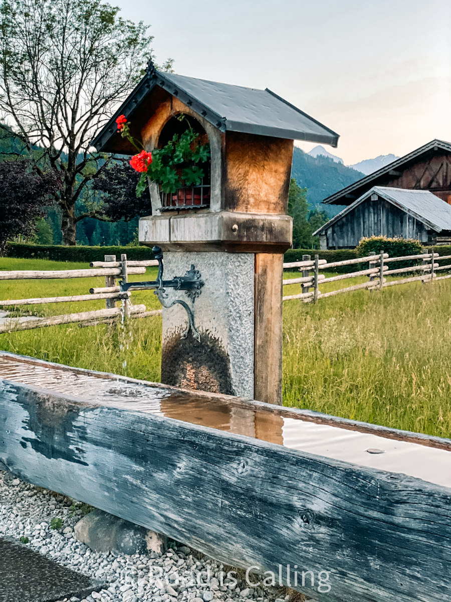 Wooden alpine fountain in southern Germany