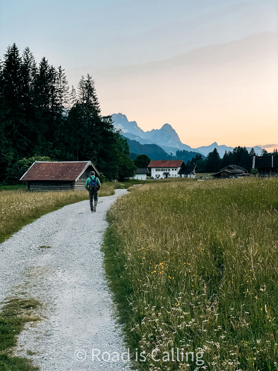 man walking on a path at sunset in a lesser-known Bavarian village