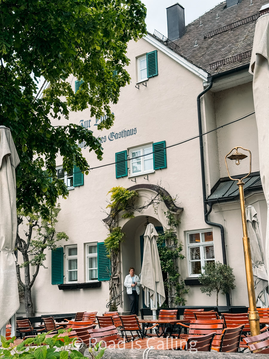 traditional Bavarian village restaurant with old architecture and outdoor seating