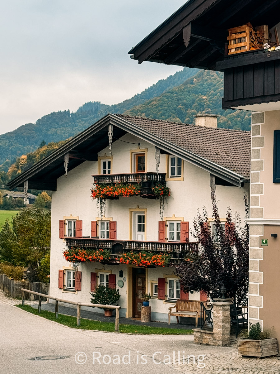 traditional Bavarian alpine house with wooden balconies and mountain views