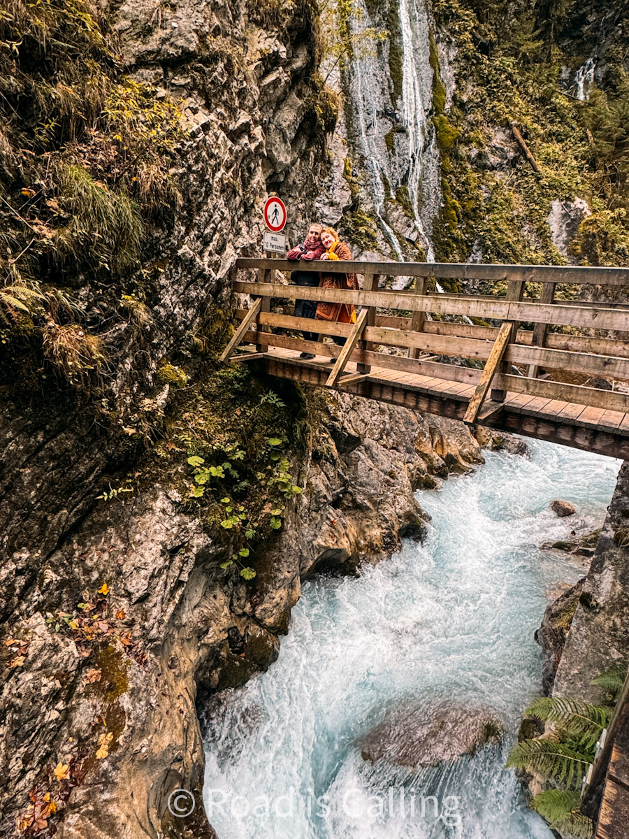 wooden walkway over a mountain gorge with beautiful river in Bavaria