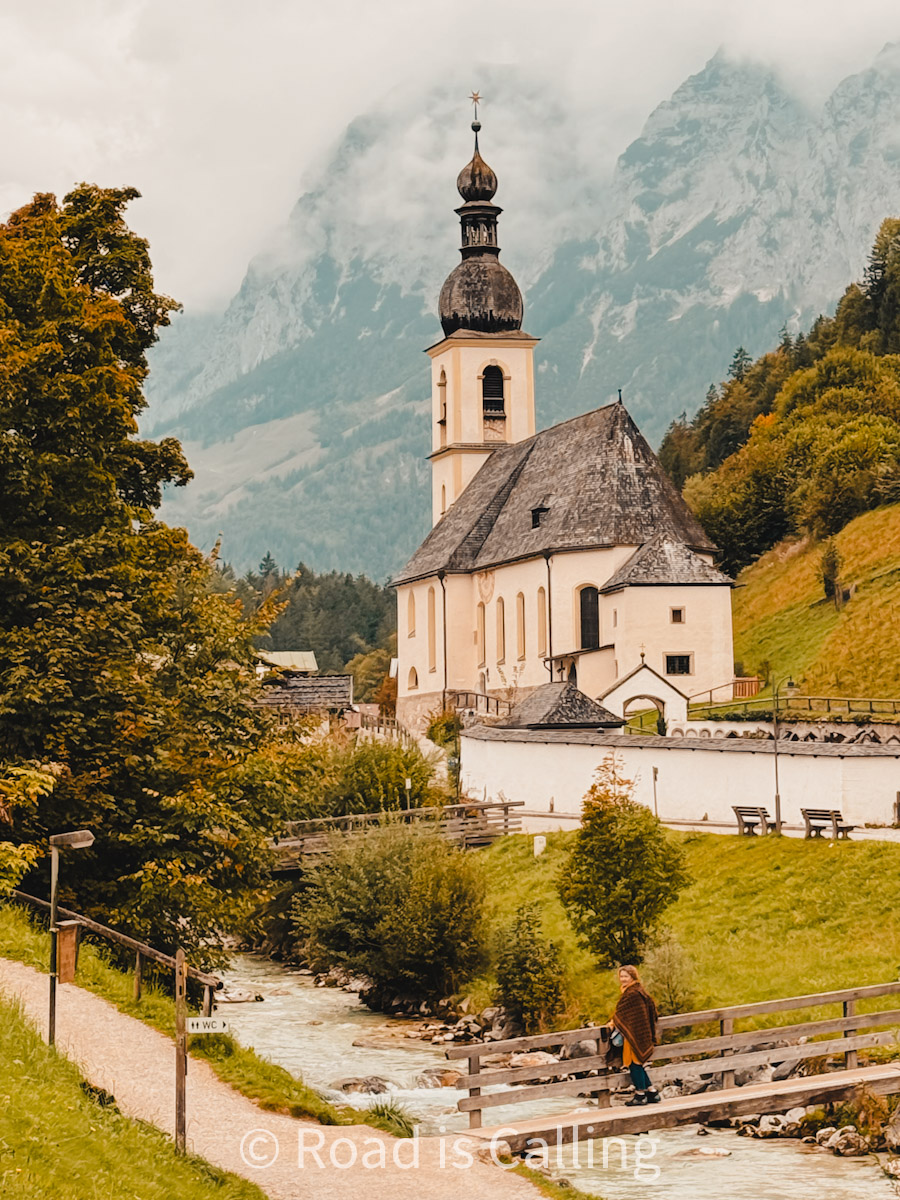 St. Sebastian church in Ramsau with alpine mountains and river