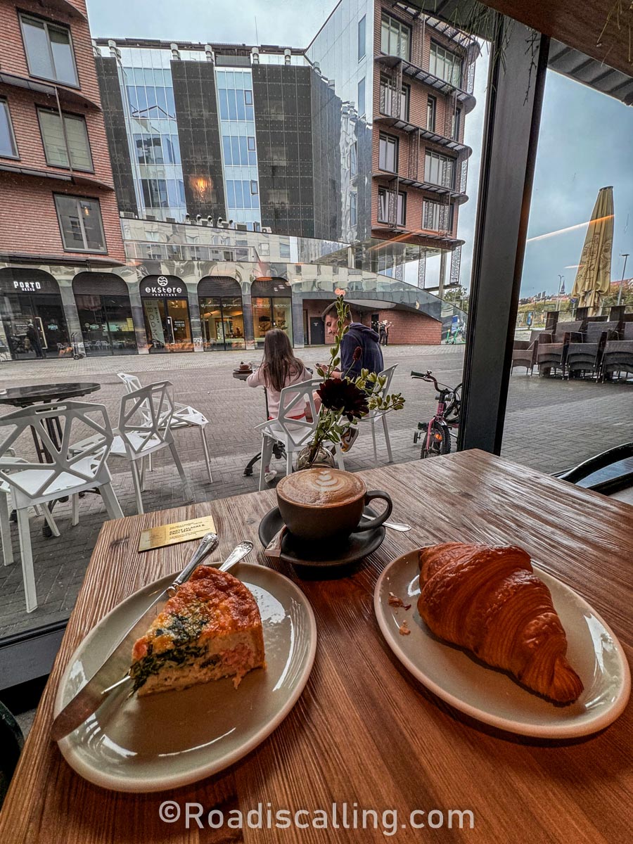 quiche croissant and a cup of coffee in a cafe in the modern part of Tallinn