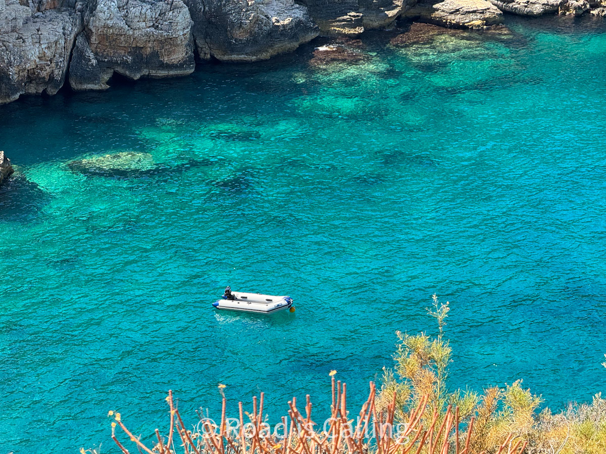 boat parked on the turquoise water of the Mediterranean sea