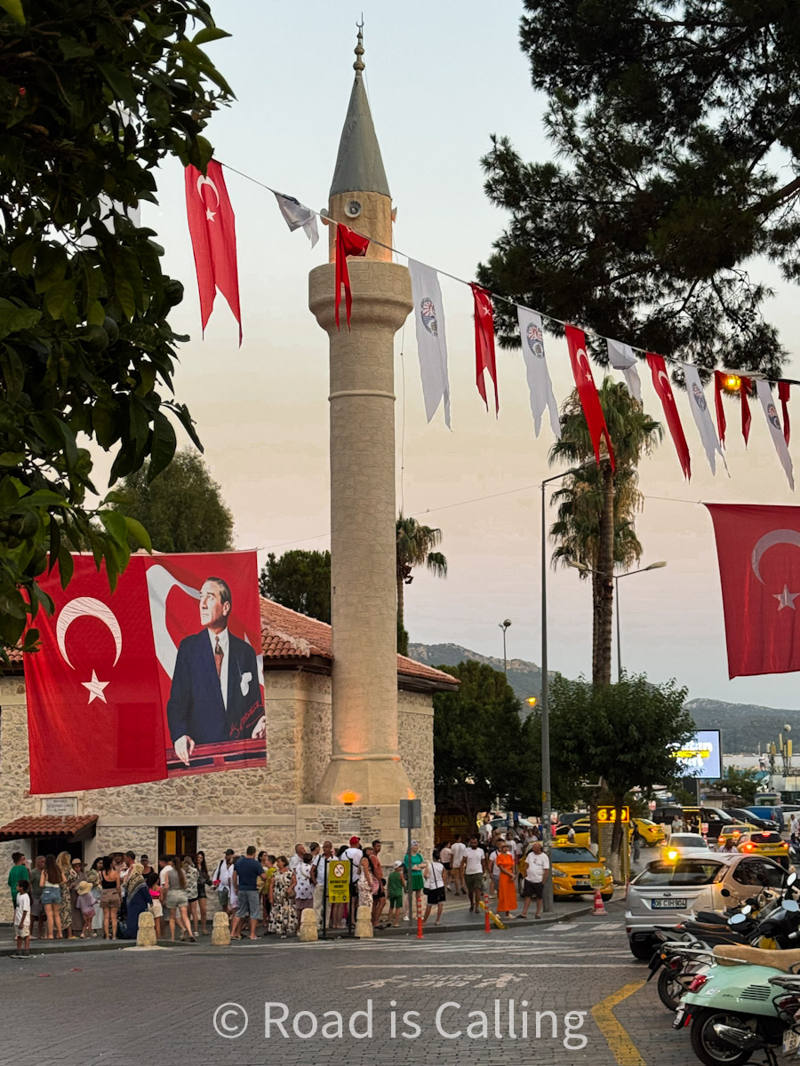 people walking on the street by the mosque in Kas