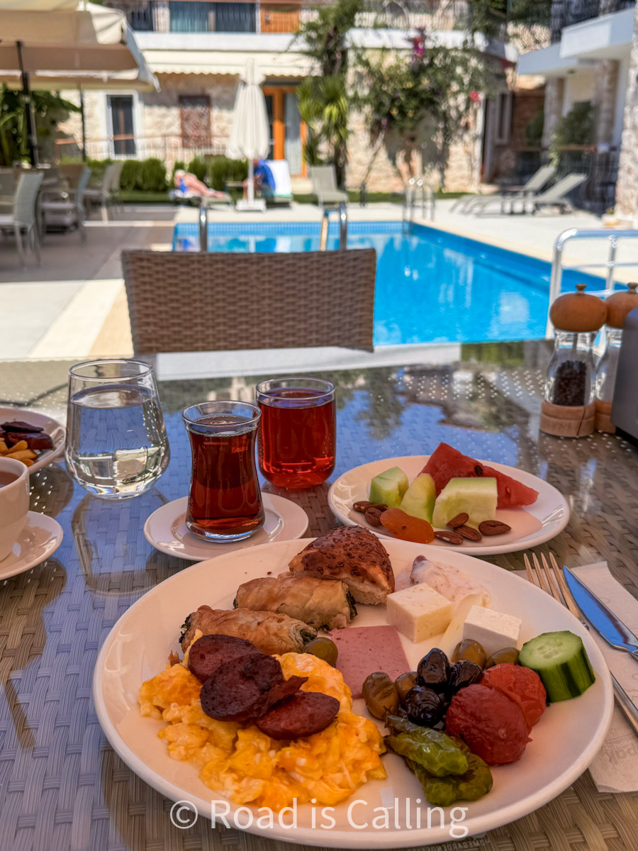 Traditional Turkish breakfast served by the pool in a boutique hotel in Kaş, Turkey