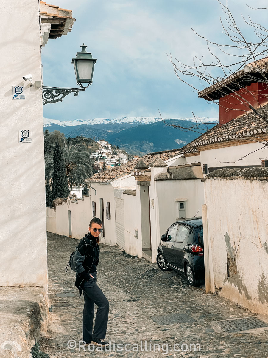 me walking on the street in Granada, Spain in winter