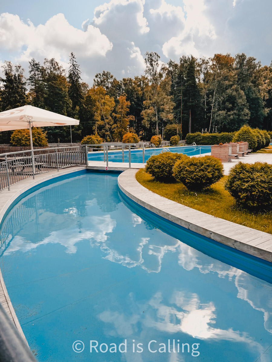 swimming pool under the open sky between trees as part of the Nomme Sports Center