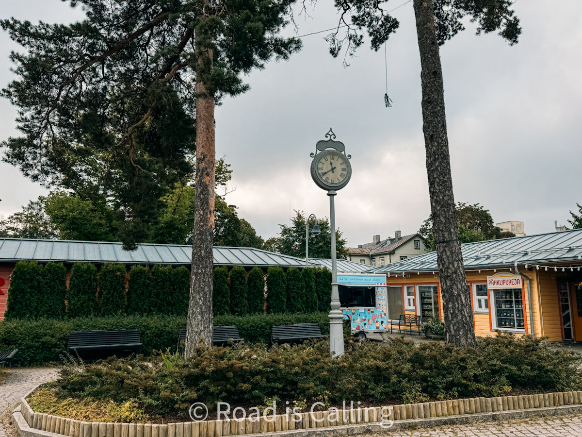 Nomme market setting with a clock and trees in Tallinn