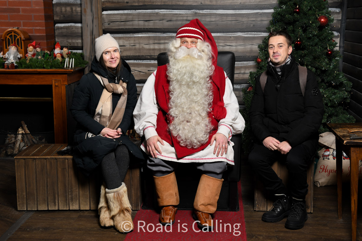 me and Mark sitting together with Santa Claus in his house in Rovaniemi