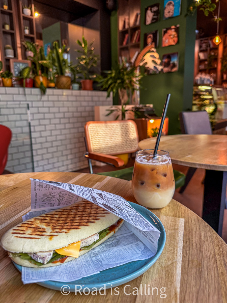panini sandwich and iced coffee served at a cozy affordable breakfast place in Tallinn Old Town