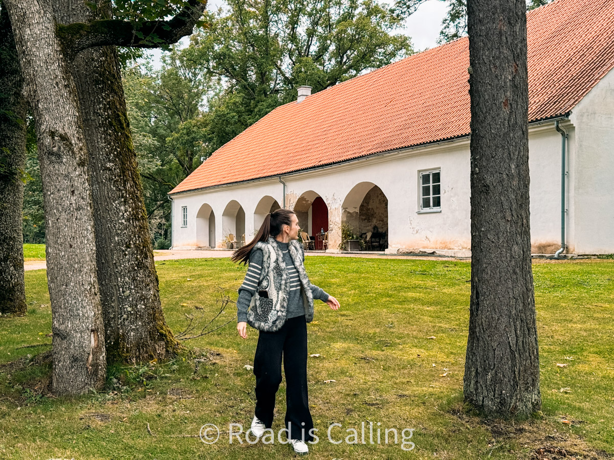 me standing in front of a manor with trees in Estonia