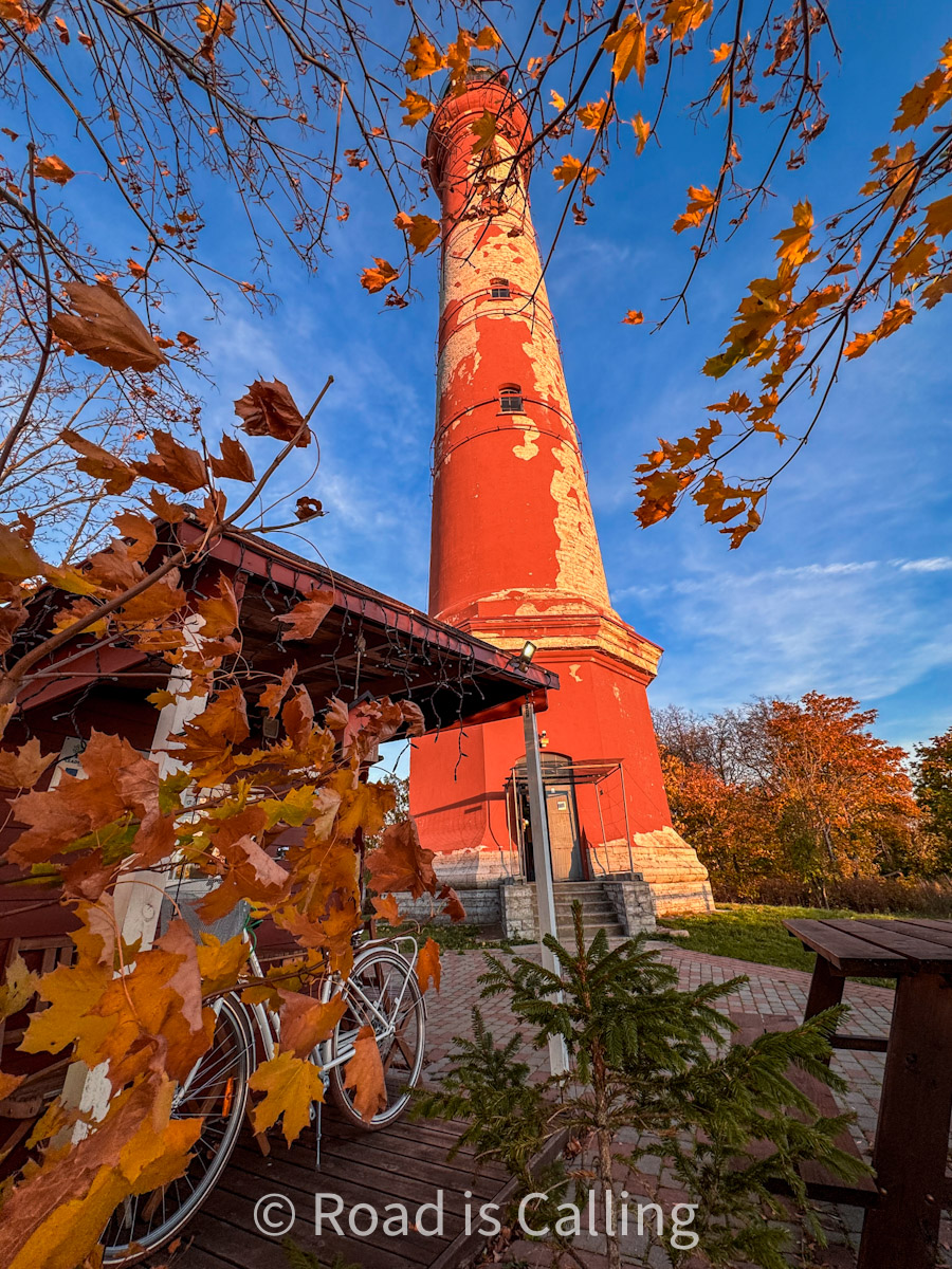 red lighthouse with autumn leaves - unique thing to do in Estonia