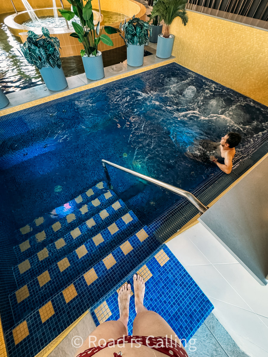 relaxing in a hot tub at a spa