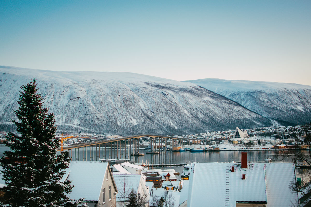 snowy winter view of Tromso with mountains 