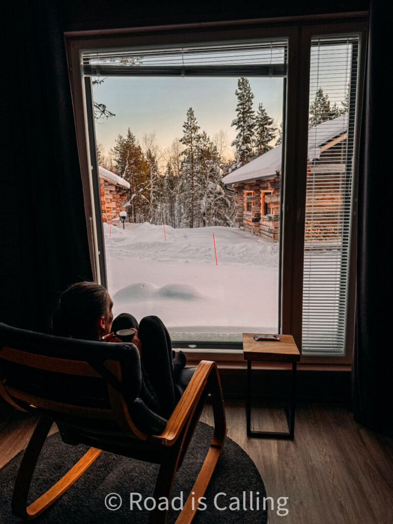 me sitting by the window in Wilderness Hotel Inari in Lapland