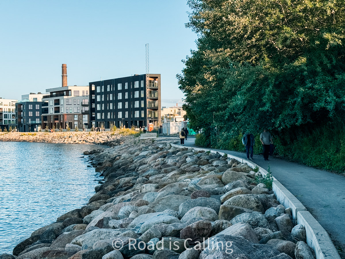 Promenade along the waterfront in Noblessner district, Tallinn, with modern apartments and walking path
