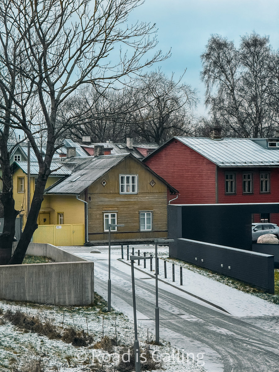 Colorful wooden houses in Kalamaja, Tallinn, with a dusting of snow in early winter