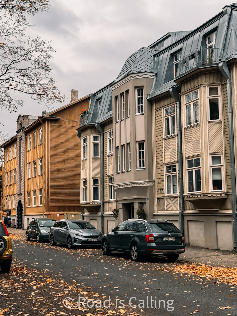 Art Nouveau and wooden buildings on a quiet street in Tallinn’s residential Kalamaja area during fall