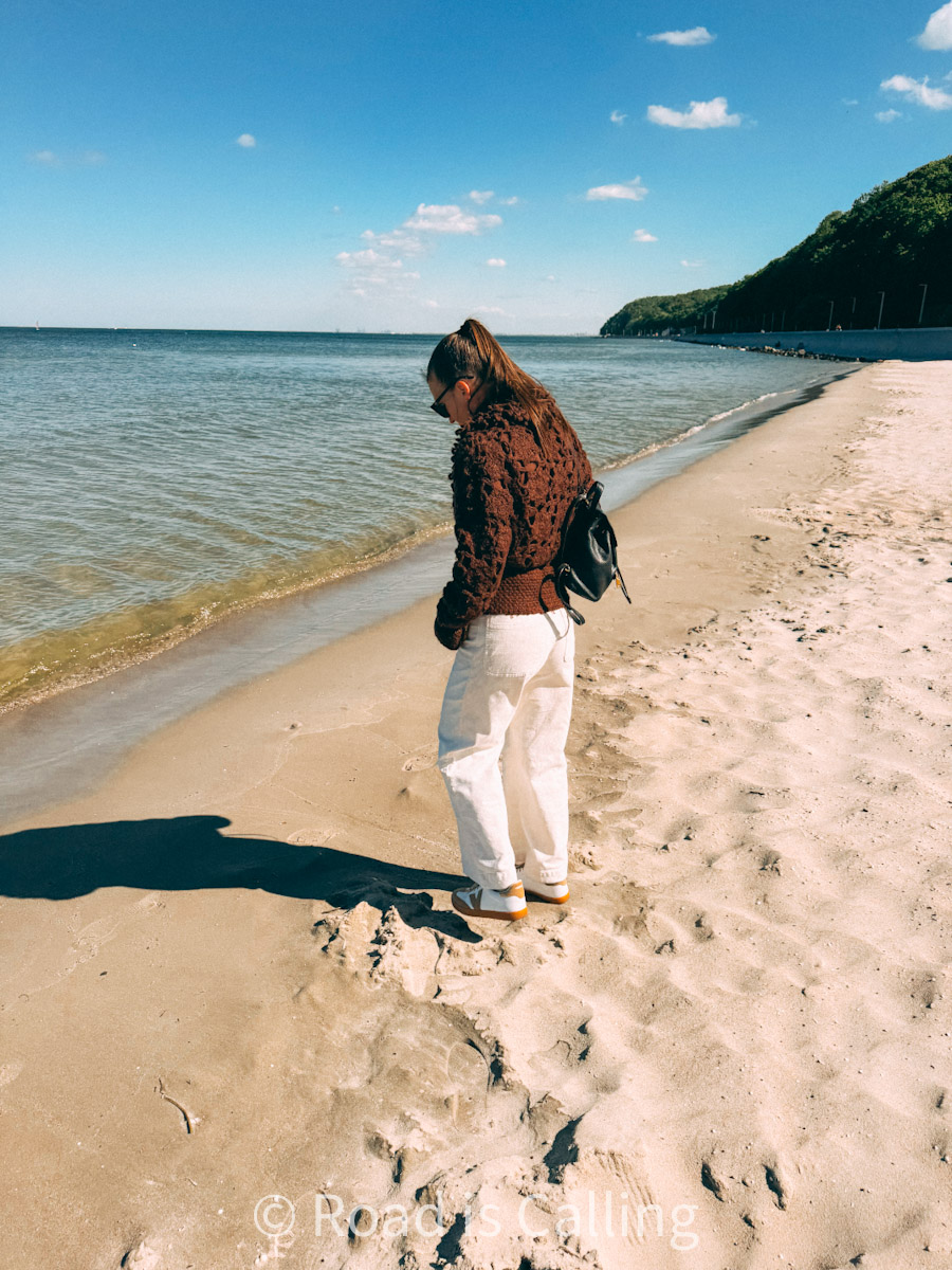 me standing on the white sand beach in Gdynya in summer