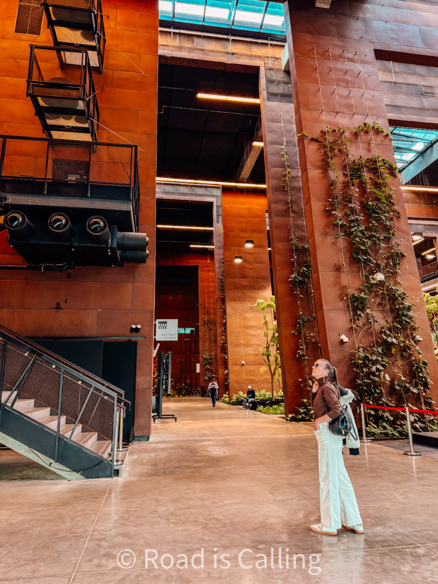 me standing in the hallway of a war museum in Gdansk in summer
