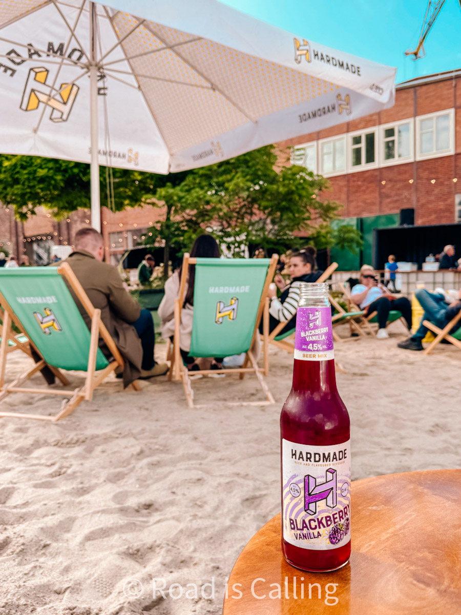 bottle of beer on the table on artificial beach in Gdansk
