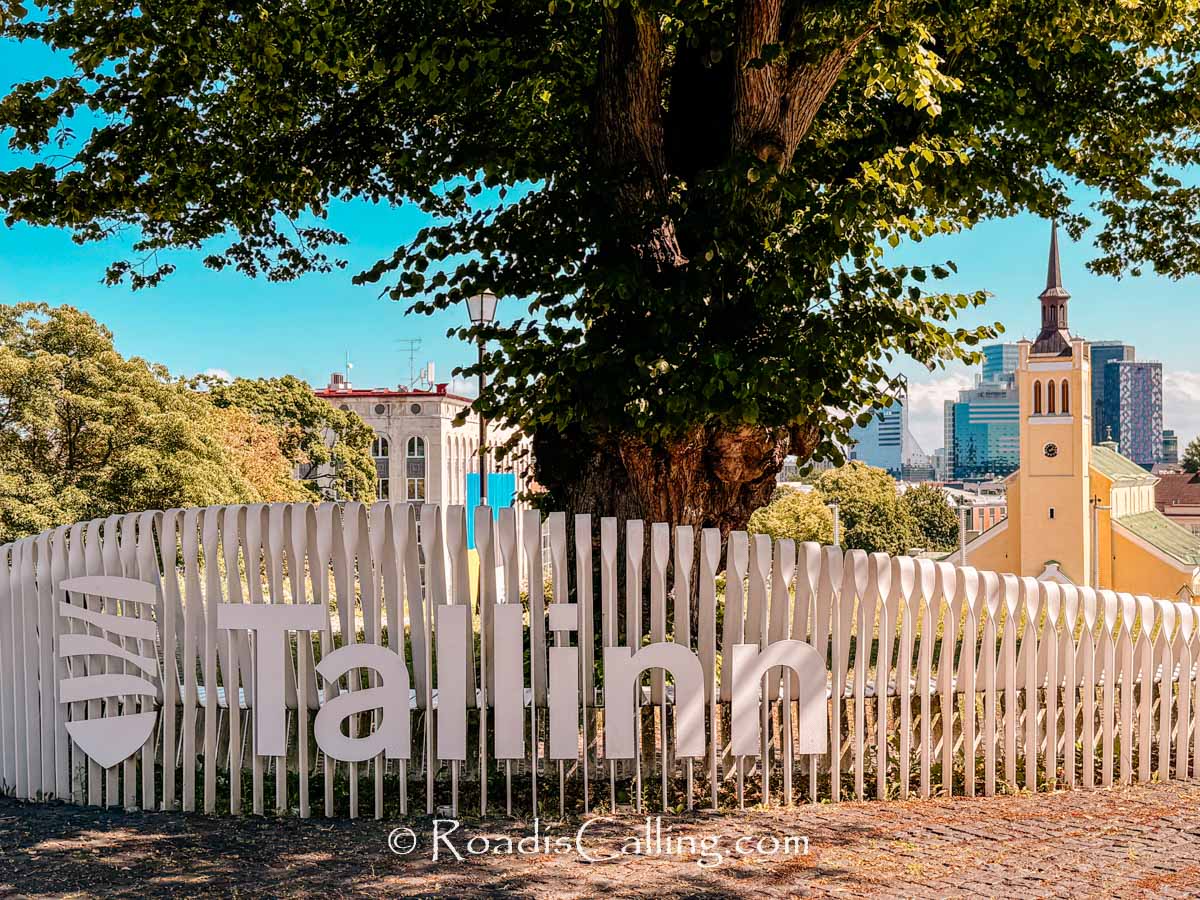 view of Tallinn city sign with church on the background
