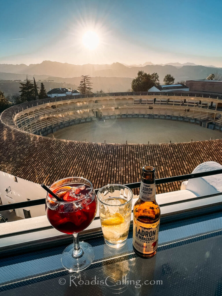 sangria and beer with a view of Ronda bullring - a great stop on a November road trip in Europe
